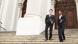 man and woman on courthouse steps